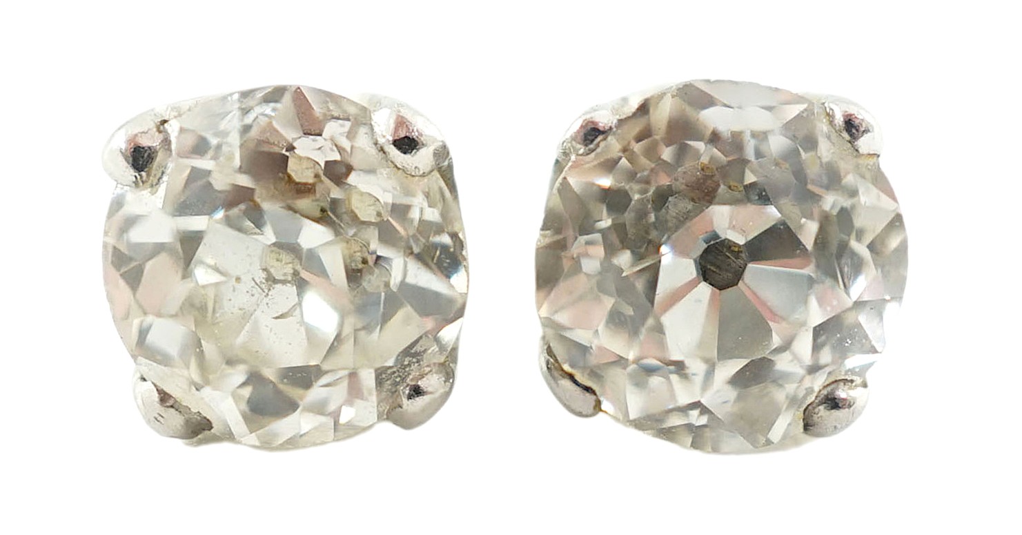 A pair of white gold? and solitaire diamond set ear studs